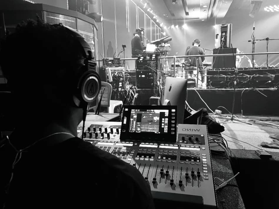 Working through a mix together at the console